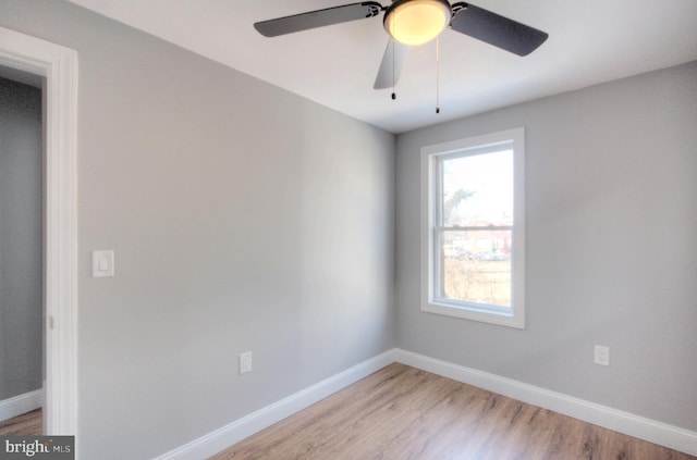 empty room with light wood-type flooring and baseboards