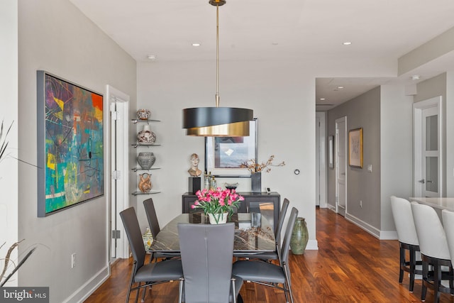 dining room with baseboards, dark wood-style flooring, and recessed lighting