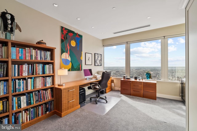 office featuring recessed lighting, light colored carpet, visible vents, and baseboards