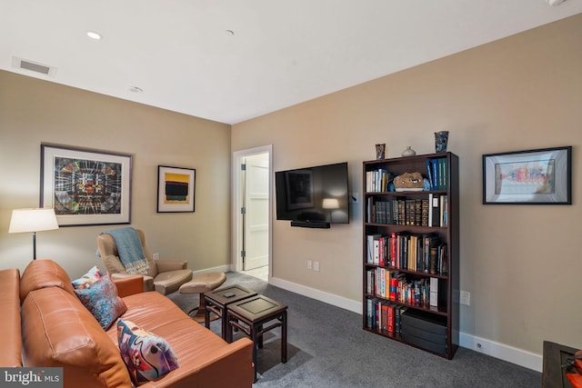 living room featuring baseboards, visible vents, dark colored carpet, and recessed lighting