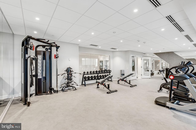 workout area featuring a paneled ceiling, visible vents, and recessed lighting