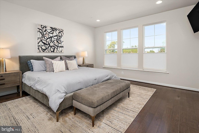 bedroom with hardwood / wood-style flooring, baseboards, and recessed lighting