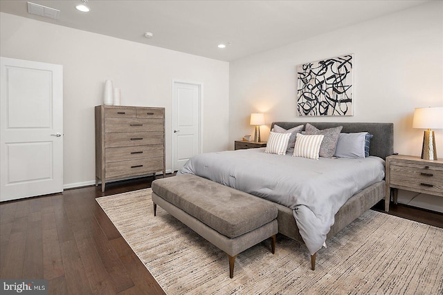 bedroom with visible vents, dark wood finished floors, and recessed lighting