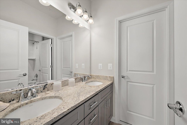 bathroom with a sink, shower / bathtub combination, and double vanity