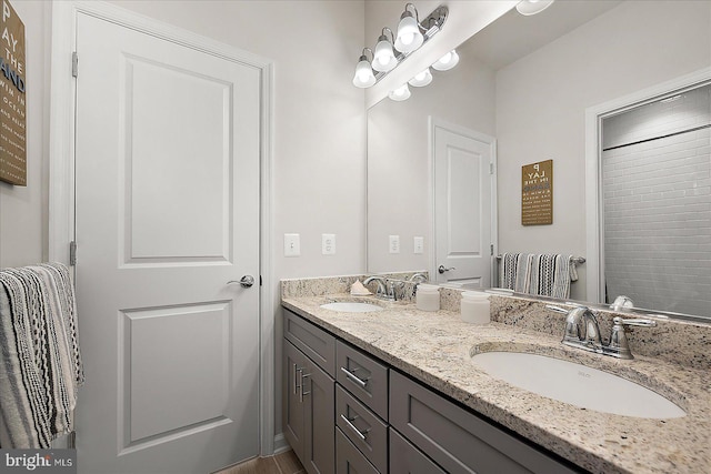 bathroom with a sink and double vanity