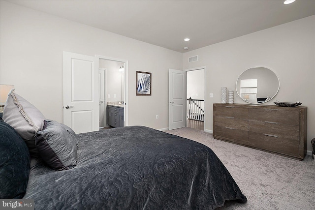 bedroom featuring baseboards, visible vents, connected bathroom, carpet floors, and recessed lighting