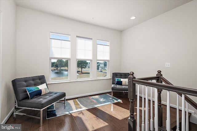 living area featuring an upstairs landing, recessed lighting, baseboards, and hardwood / wood-style flooring