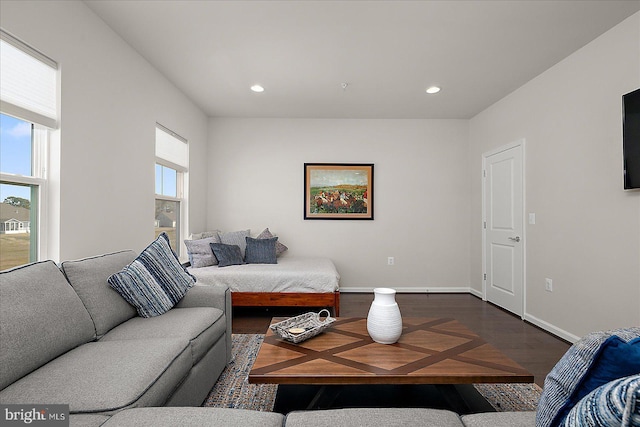 living area with dark wood-style floors, baseboards, and recessed lighting