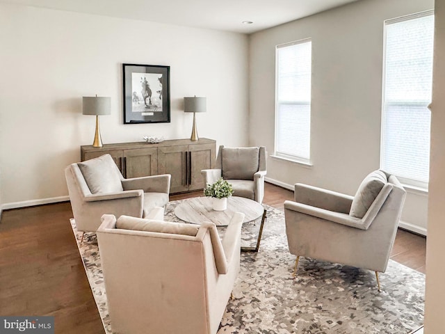 sitting room with wood finished floors and baseboards