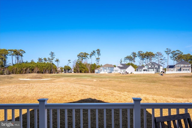 view of yard featuring a residential view and fence