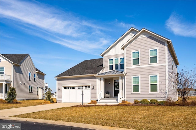 view of front of house with a garage, concrete driveway, a standing seam roof, a front lawn, and board and batten siding