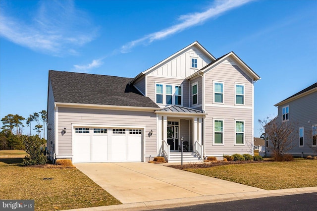 view of front of home with a garage, concrete driveway, a standing seam roof, a front lawn, and board and batten siding