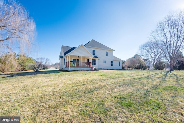 view of front facade featuring covered porch, a front lawn, and a ceiling fan