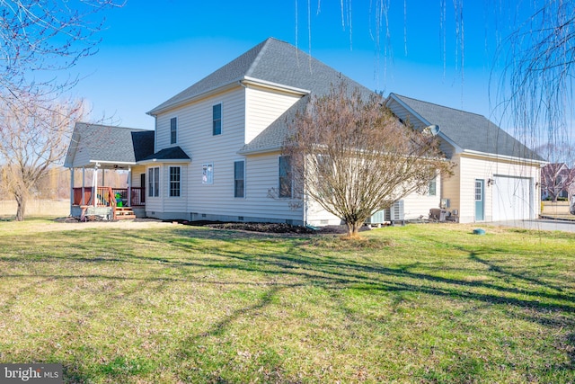 view of side of property featuring a garage, crawl space, roof with shingles, and a lawn