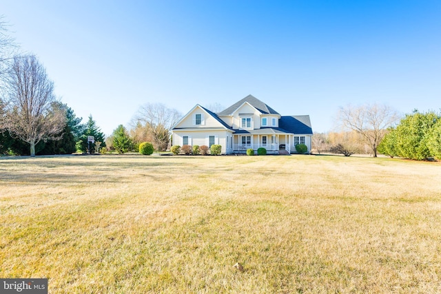 view of front of house with covered porch and a front lawn