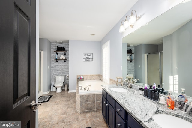 bathroom with a stall shower, a sink, a bath, and tile patterned floors