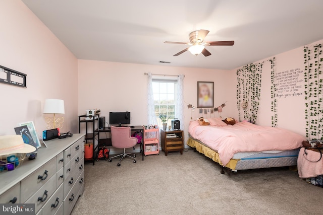 bedroom featuring a ceiling fan, light colored carpet, and visible vents