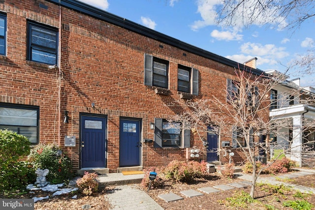 view of property with brick siding