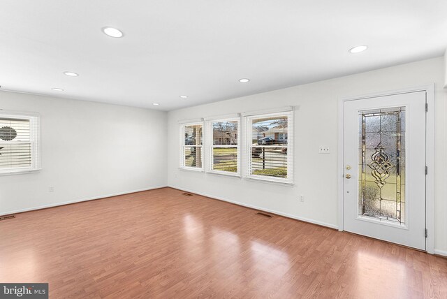 interior space featuring plenty of natural light, visible vents, wood finished floors, and recessed lighting