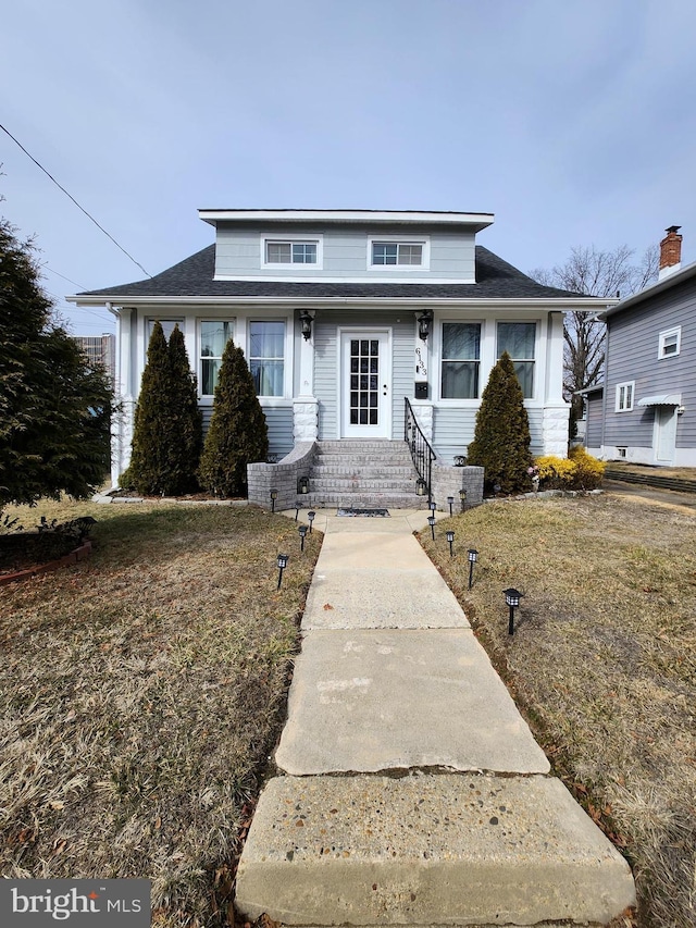 bungalow with a front lawn