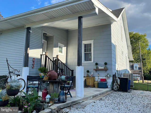 back of house with fence