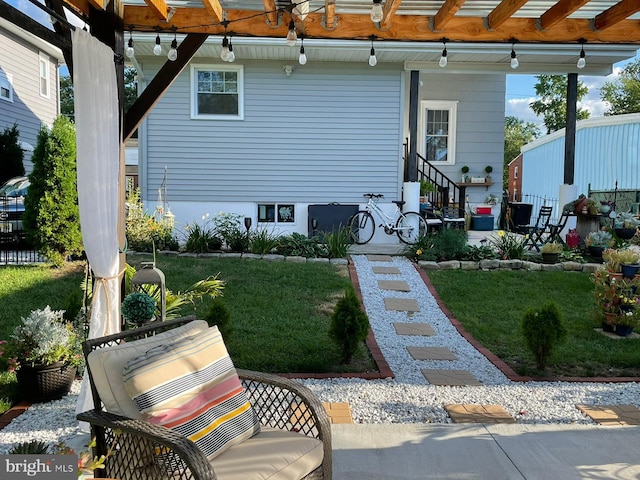 exterior space with entry steps and a front yard