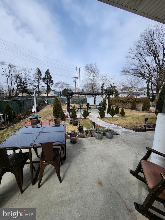 view of patio / terrace featuring outdoor dining area, fence, and a pergola