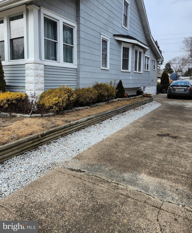 view of property exterior featuring driveway