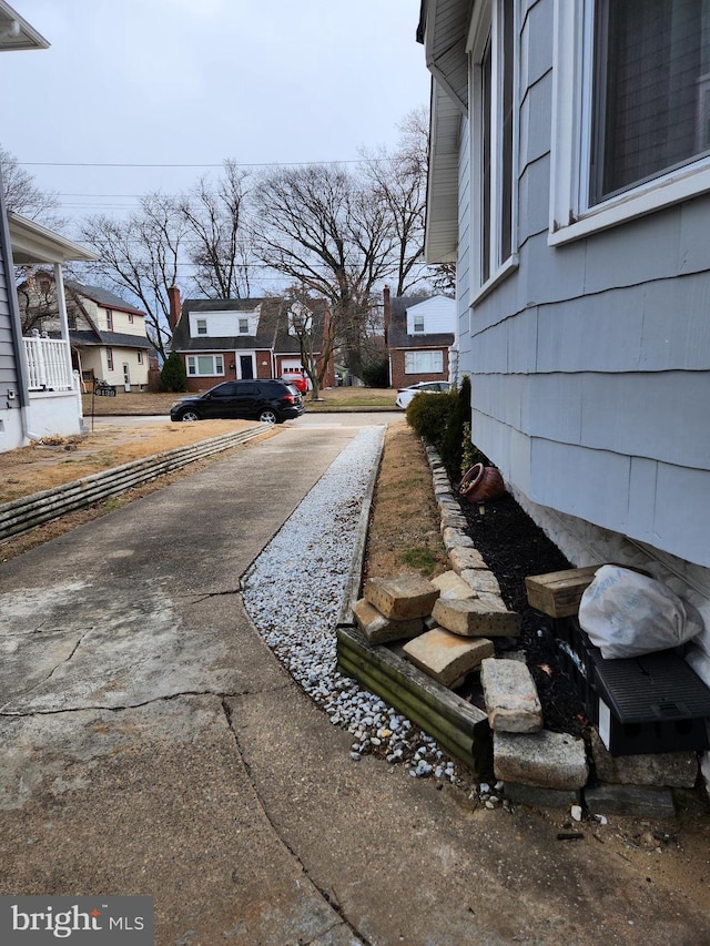 exterior space featuring a residential view and driveway