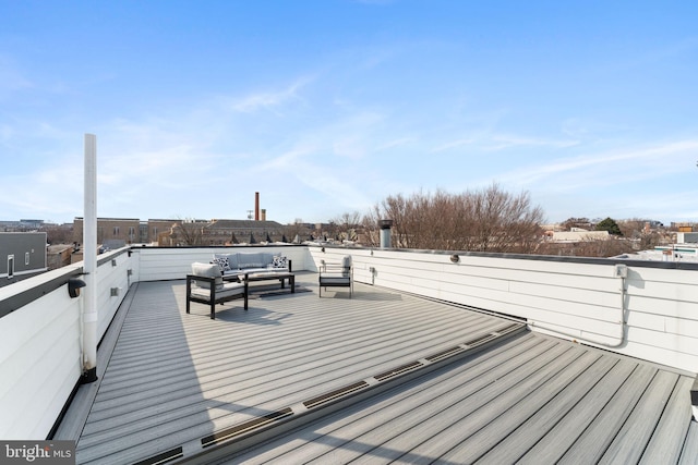 wooden deck with an outdoor living space