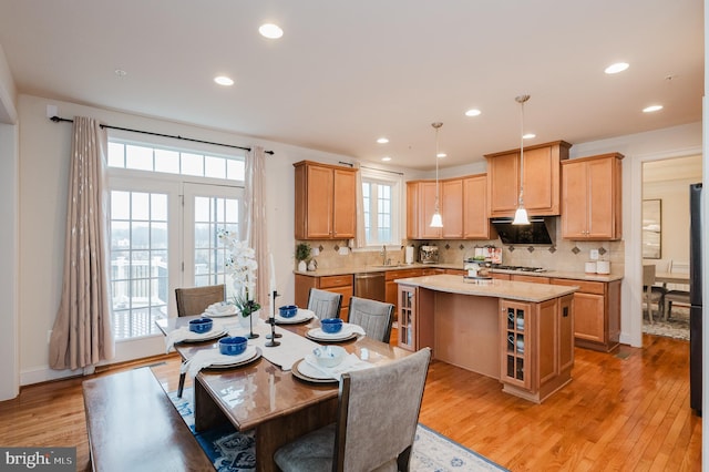 dining area featuring light wood-style floors and recessed lighting