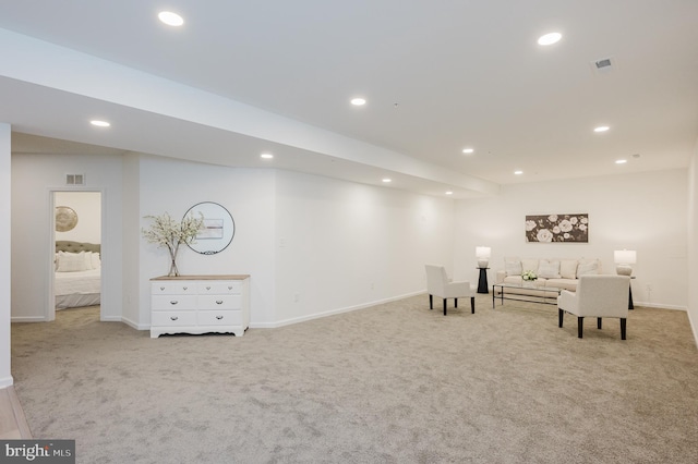 living area featuring baseboards, carpet flooring, and recessed lighting