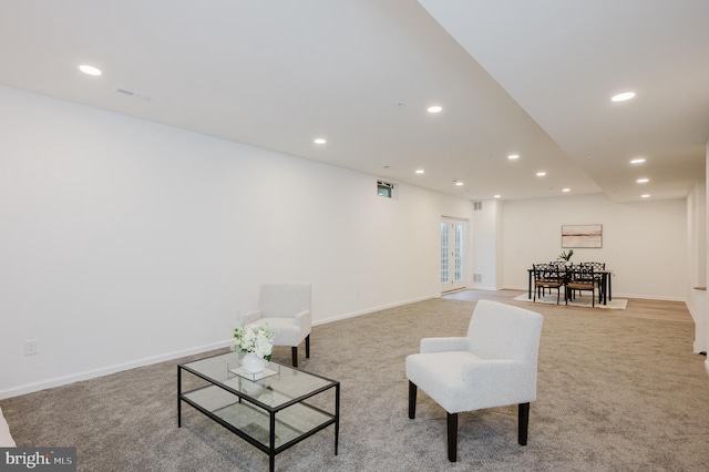 interior space with recessed lighting and light colored carpet