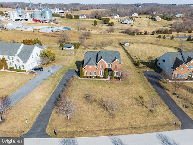 birds eye view of property with a residential view