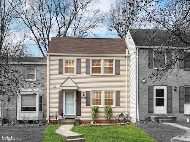 view of front of home with a front yard