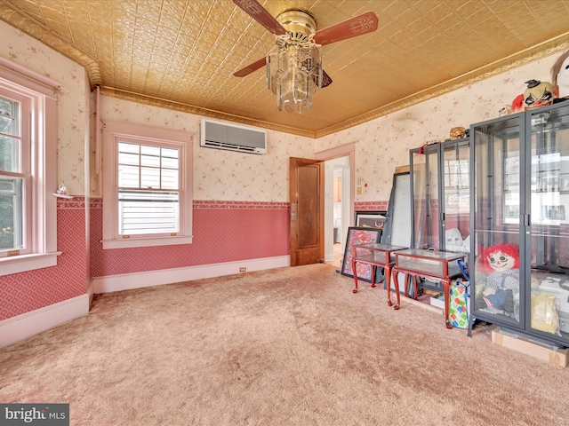 recreation room featuring a wall unit AC, carpet floors, wainscoting, an ornate ceiling, and wallpapered walls