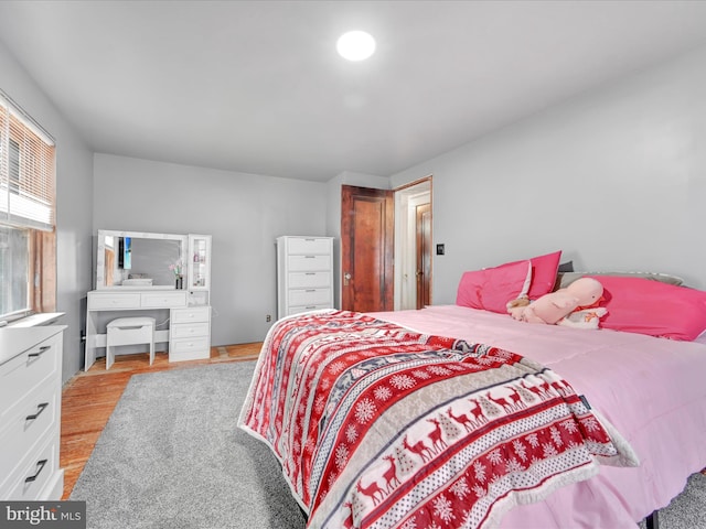 bedroom with light wood-type flooring