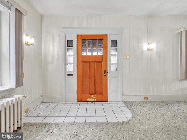 tiled foyer with radiator