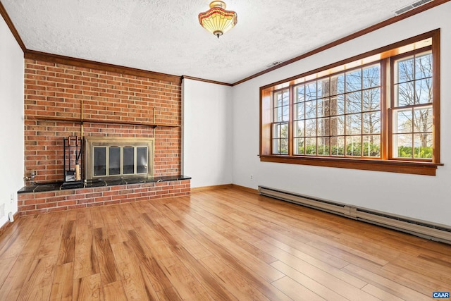 unfurnished living room featuring a textured ceiling, a baseboard radiator, ornamental molding, a brick fireplace, and light wood finished floors