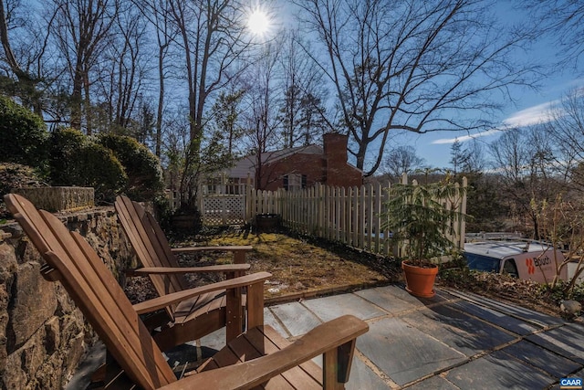 view of patio featuring fence