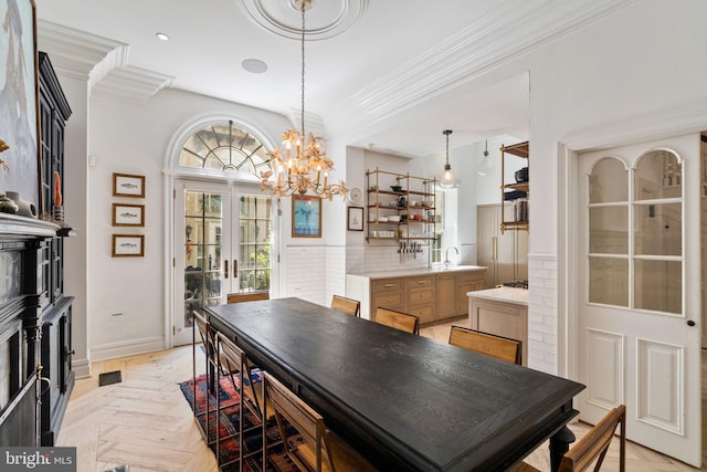 922 Clinton St, Philadelphia, PA 19107 - dining area featuring ornamental molding, a chandelier, french doors, and baseboards