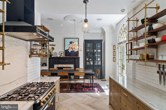 922 Clinton St, Philadelphia, PA 19107 - kitchen featuring wall chimney range hood, stainless steel range with gas stovetop, open shelves, light stone countertops, and decorative light fixtures