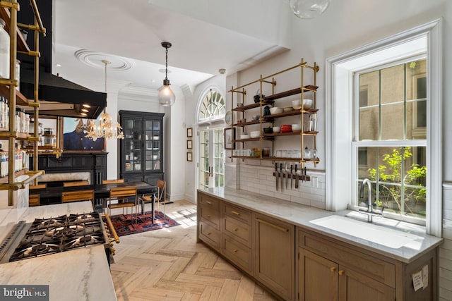 922 Clinton St, Philadelphia, PA 19107 - kitchen featuring a sink, baseboards, backsplash, pendant lighting, and open shelves