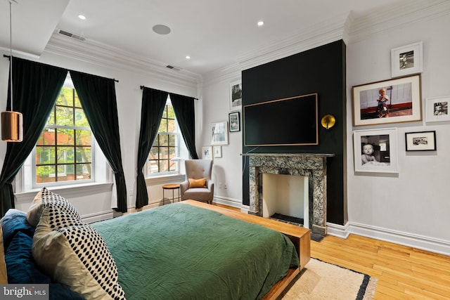 922 Clinton St, Philadelphia, PA 19107 - bedroom featuring wood-type flooring, baseboards, a high end fireplace, ornamental molding, and recessed lighting