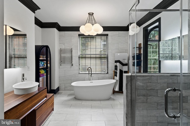 922 Clinton St, Philadelphia, PA 19107 - full bath featuring plenty of natural light, a stall shower, vanity, a freestanding bath, and tile walls
