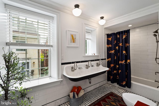 922 Clinton St, Philadelphia, PA 19107 - full bath with plenty of natural light, tile walls, a sink, shower / bath combo, and ornamental molding