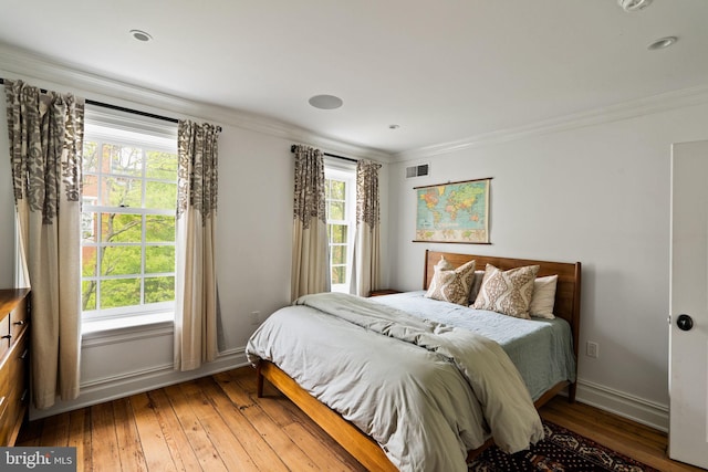 922 Clinton St, Philadelphia, PA 19107 - bedroom featuring hardwood / wood-style flooring, multiple windows, crown molding, and baseboards