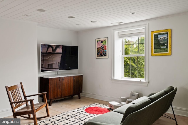 922 Clinton St, Philadelphia, PA 19107 - living room with light wood-style floors, baseboards, wooden ceiling, and crown molding