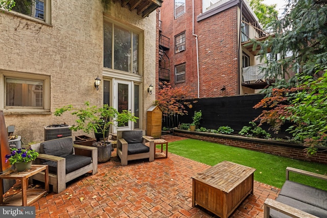 922 Clinton St, Philadelphia, PA 19107 - fenced backyard featuring a patio, central AC, and an outdoor hangout area