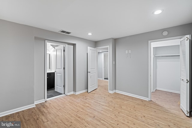 922 Clinton St, Philadelphia, PA 19107 - unfurnished bedroom with baseboards, light wood finished floors, recessed lighting, a closet, and a spacious closet